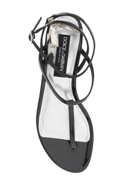 Shop Dolce & Gabbana Patent Leather Thong Sandals With Padlock Women In Black