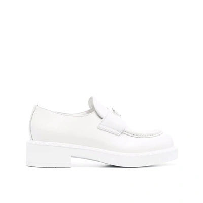 Shop Prada Leather Loafers In White