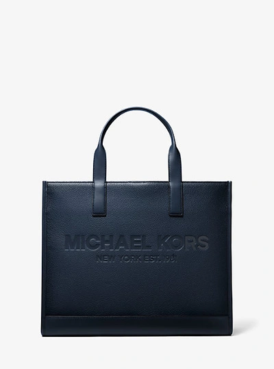 Shop Michael Kors Cooper Logo Embossed Pebbled Leather Tote Bag In Blue
