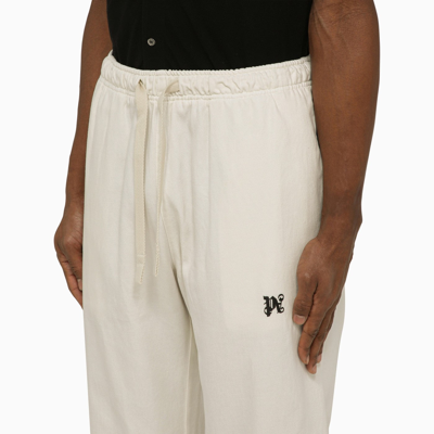 Shop Palm Angels Off White Jogging Trousers With Monogram