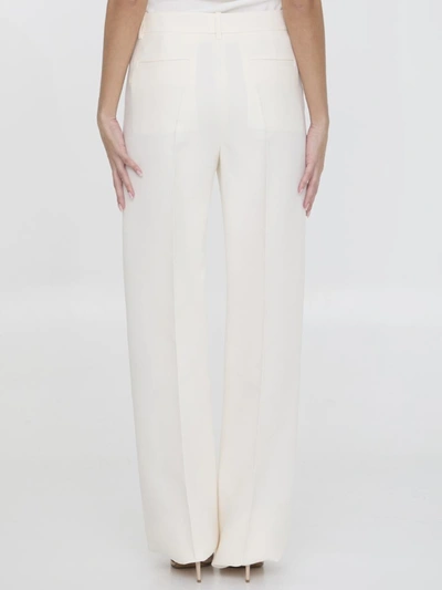 Shop Valentino Crepe Couture Trousers In Cream