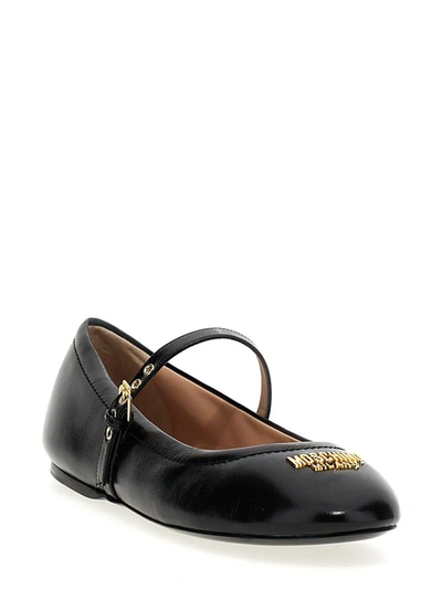 Shop Moschino Logo Leather Ballet Flats In Black