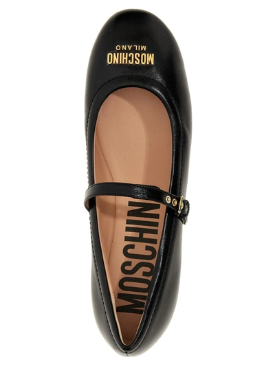 Shop Moschino Logo Leather Ballet Flats In Black