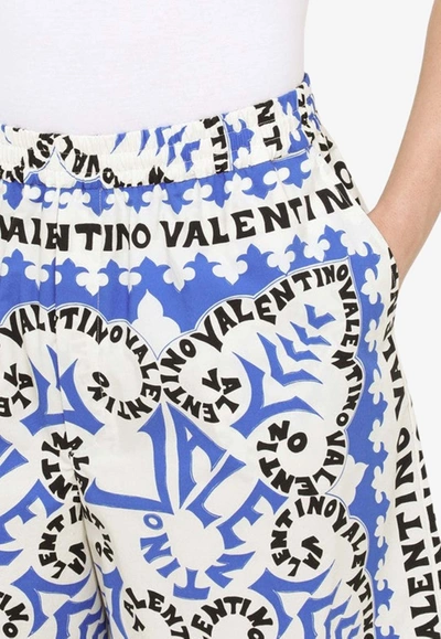 Shop Valentino All-over Print Bermuda Shorts In Blue