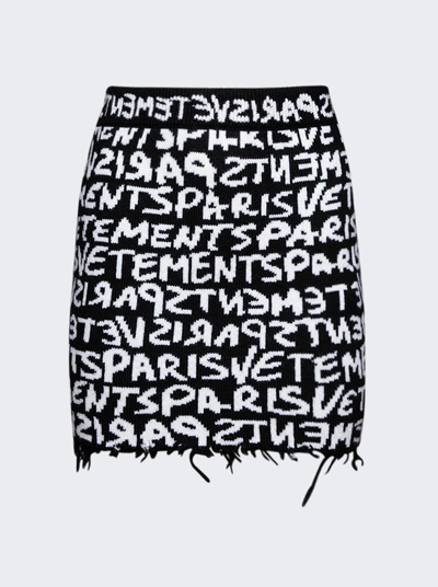 Shop Vetements Graffiti Monogram Mini Skirt In Black And White