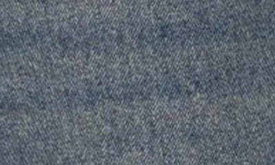 Shop Edikted Mattie Side Stripe Bow Low Rise Wide Leg Jeans In Blue-washed