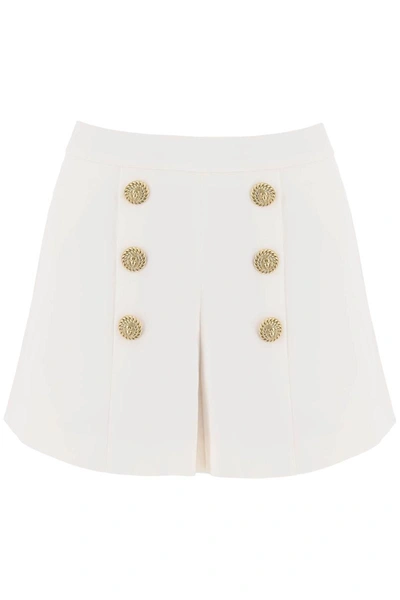 Shop Balmain Crepe Shorts With Embossed Buttons In White