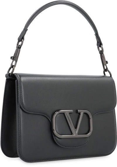 Shop Valentino Garavani - Locò Shoulder Bag In Black