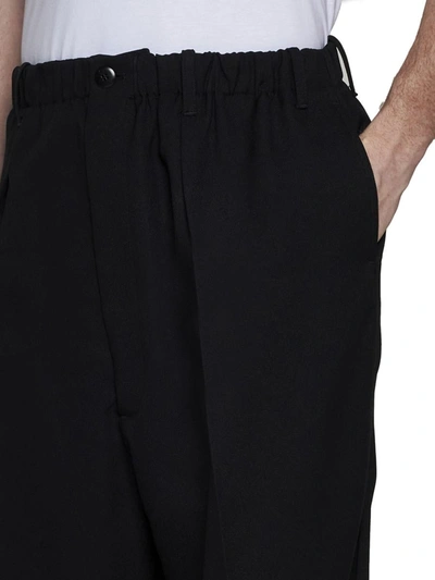 Shop Random Identities Trousers In Black