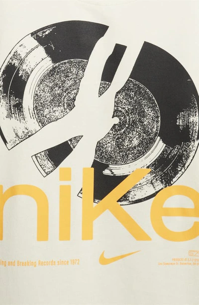 Shop Nike Dri-fit Studio '72 Graphic T-shirt In Sea Glass/ Sundial
