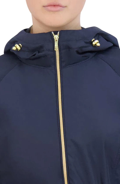 Shop Cole Haan Travel Packable Hooded Rain Jacket In Indigo
