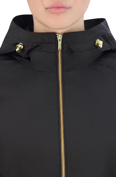 Shop Cole Haan Travel Packable Hooded Rain Jacket In Black