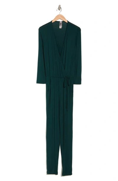 Shop Go Couture Long Sleeve Faux Wrap Jumpsuit In Hunter Green