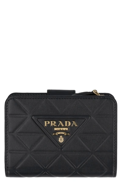 Shop Prada Small Leather Flap-over Wallet In Black