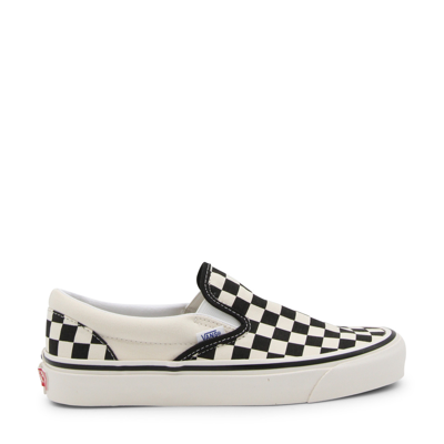 Shop Vans White And Black Canvas Sneakers