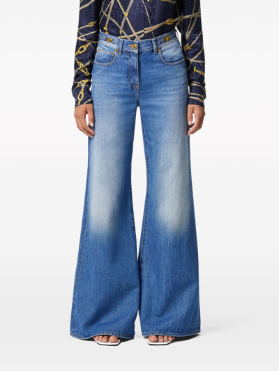 Shop Versace Wide Leg Denim Jeans In Blue