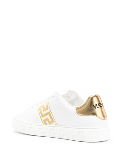 Shop Versace Greca Embroidered Sneakers In Gold