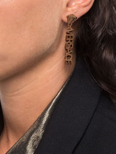 Shop Versace La Medusa Logo Drop Earrings In Gold