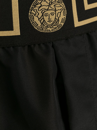 Shop Versace Greca Trim Swim Shorts In Black