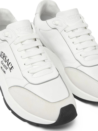 Shop Versace Sneakers In White