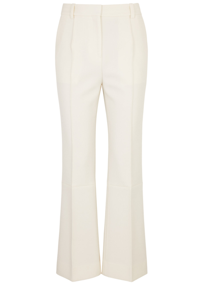 Shop Victoria Beckham Slim-leg Flared Trousers In Ivory