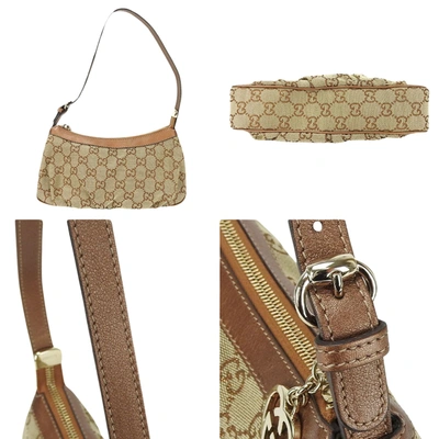 Shop Gucci Gg Canvas Camel Canvas Clutch Bag ()