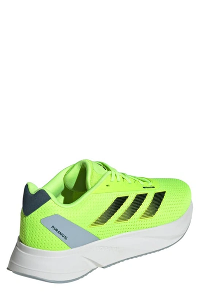 Shop Adidas Originals Duramo Sl Running Shoe In Lemon/ Black/ Blue