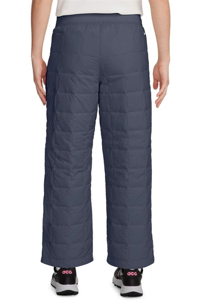 Shop Nike Acg Therma-fit Adv Quilted Insulated Wide Leg Pants In Thunder Blue/ Summit White