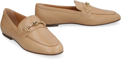 Shop Tod's Pebbled Leather Loafers In Beige
