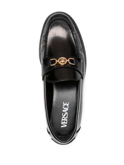 Shop Versace Flat Shoes In Nero E Oro