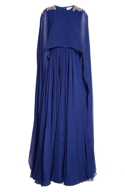 Shop Alexander Mcqueen Strapless Silk Chiffon Gown With Embellished Cape Overlay In Electric Navy