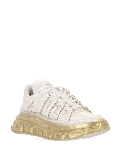 Shop Versace Sneakers In White+gold