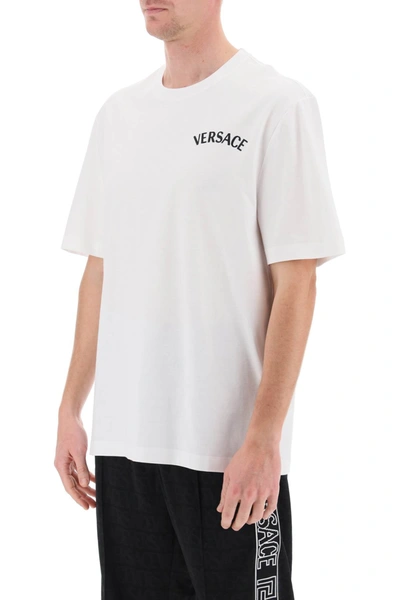 Shop Versace Milano Stamp Crew-neck T-shirt Men In White