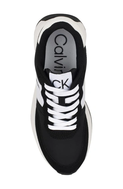 Shop Calvin Klein Hallie Wedge Sneaker In Black