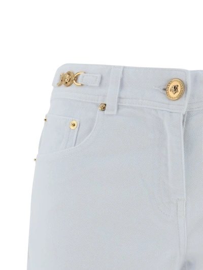 Shop Versace Pants In White