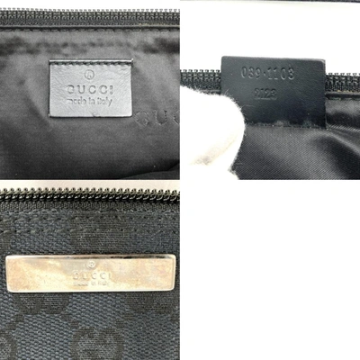 Shop Gucci Baguette Black Canvas Clutch Bag ()