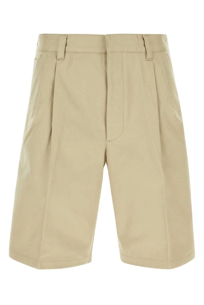 Shop Prada Pleated Knee-length Shorts In Beige