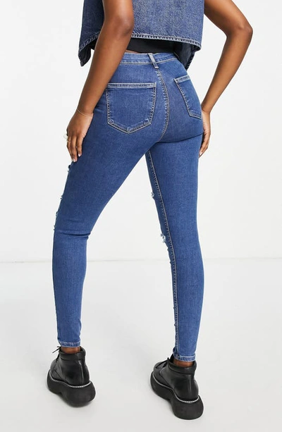 Shop Topshop Joni Ripped High Waist Skinny Jeans In Mid Blue