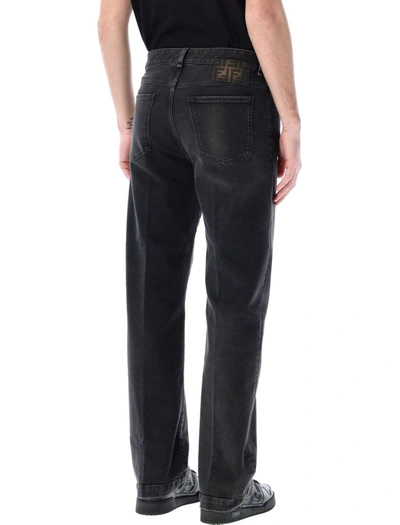 Shop Fendi Faded Denim Jeans In Black