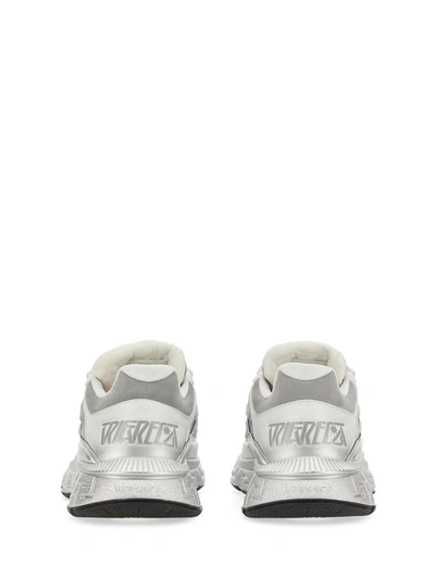 Shop Versace Trigrecan Sneakers In White