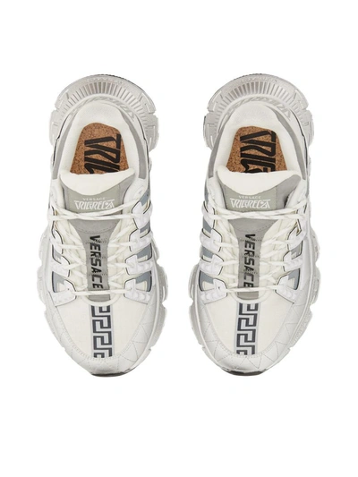 Shop Versace Trigrecan Sneakers In White