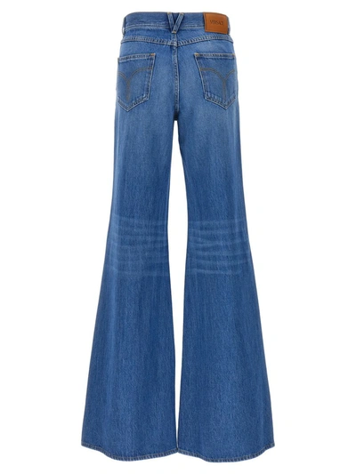 Shop Versace Flared Jeans In Blue