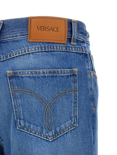 Shop Versace Flared Jeans In Blue