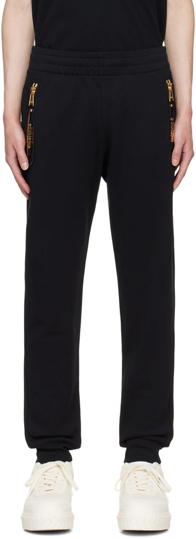 Shop Moschino Black Hardware Sweatpants In A0555