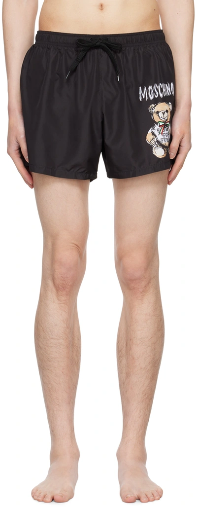 Shop Moschino Black Printed Swim Shorts In A1555