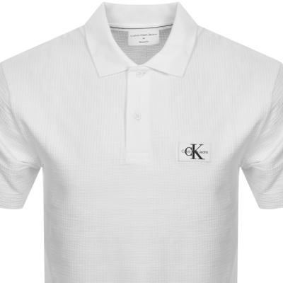 Shop Calvin Klein Jeans Relaxed Fit Polo T Shirt White