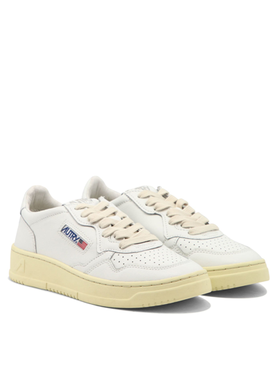Autry Low-top Sneakers With Contrast Sole And Perforated Detailing In White