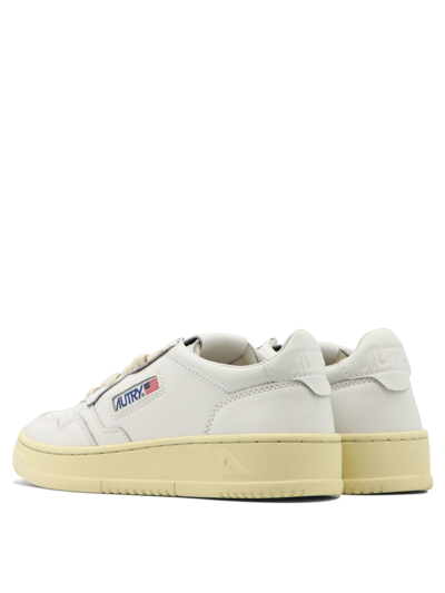 Autry Low-top Sneakers With Contrast Sole And Perforated Detailing In White