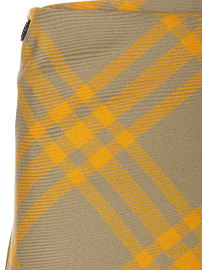 Burberry Fringed Pleated Checked Woven Mini Wrap Skirt In Yellow