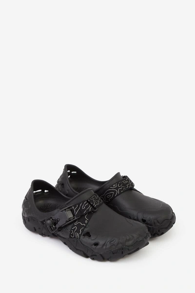 Shop Crocs Flats In Black